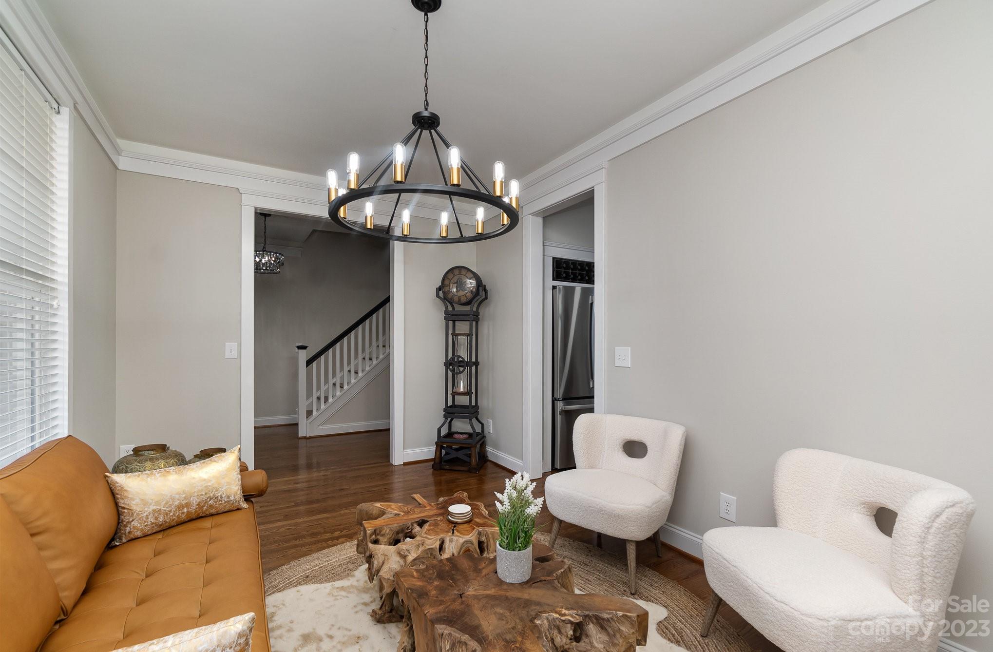 8128 Townley Road Huntersville, NC 28078 - Photo 4 of 20 a living room with furniture and a chandelier