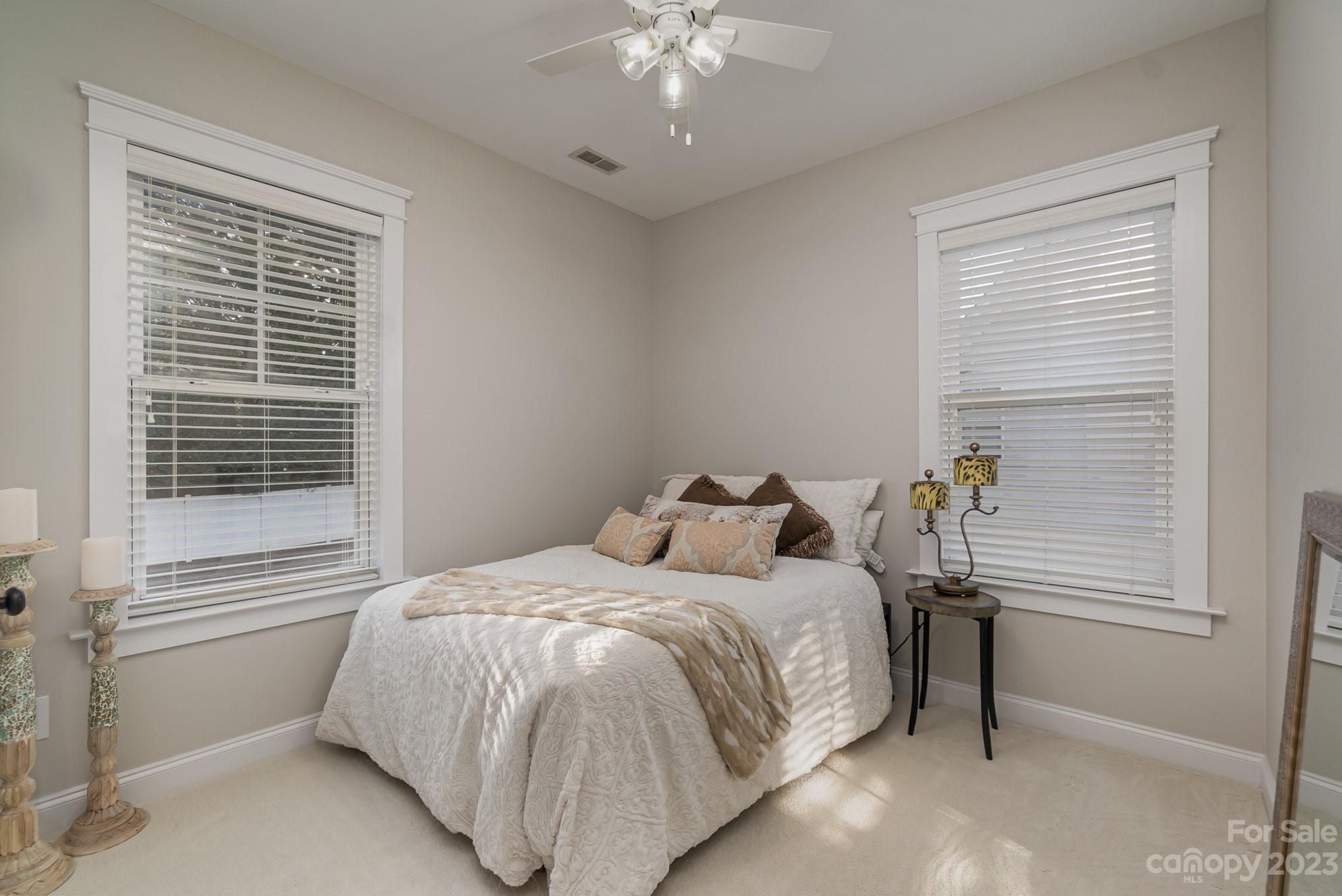 8128 Townley Road Huntersville, NC 28078 - Photo 10 of 20 a bedroom with a bed and a chandelier