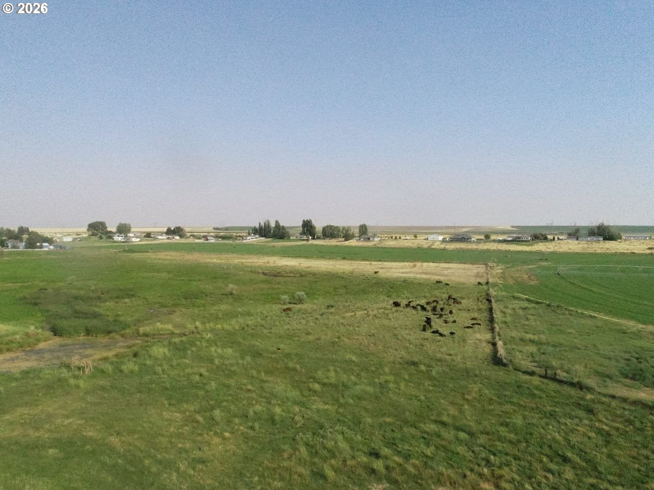 3 Parcels Highway Irrigon, OR 97844 - Photo 5 of 10 a view of a field with an ocean and trees in the background