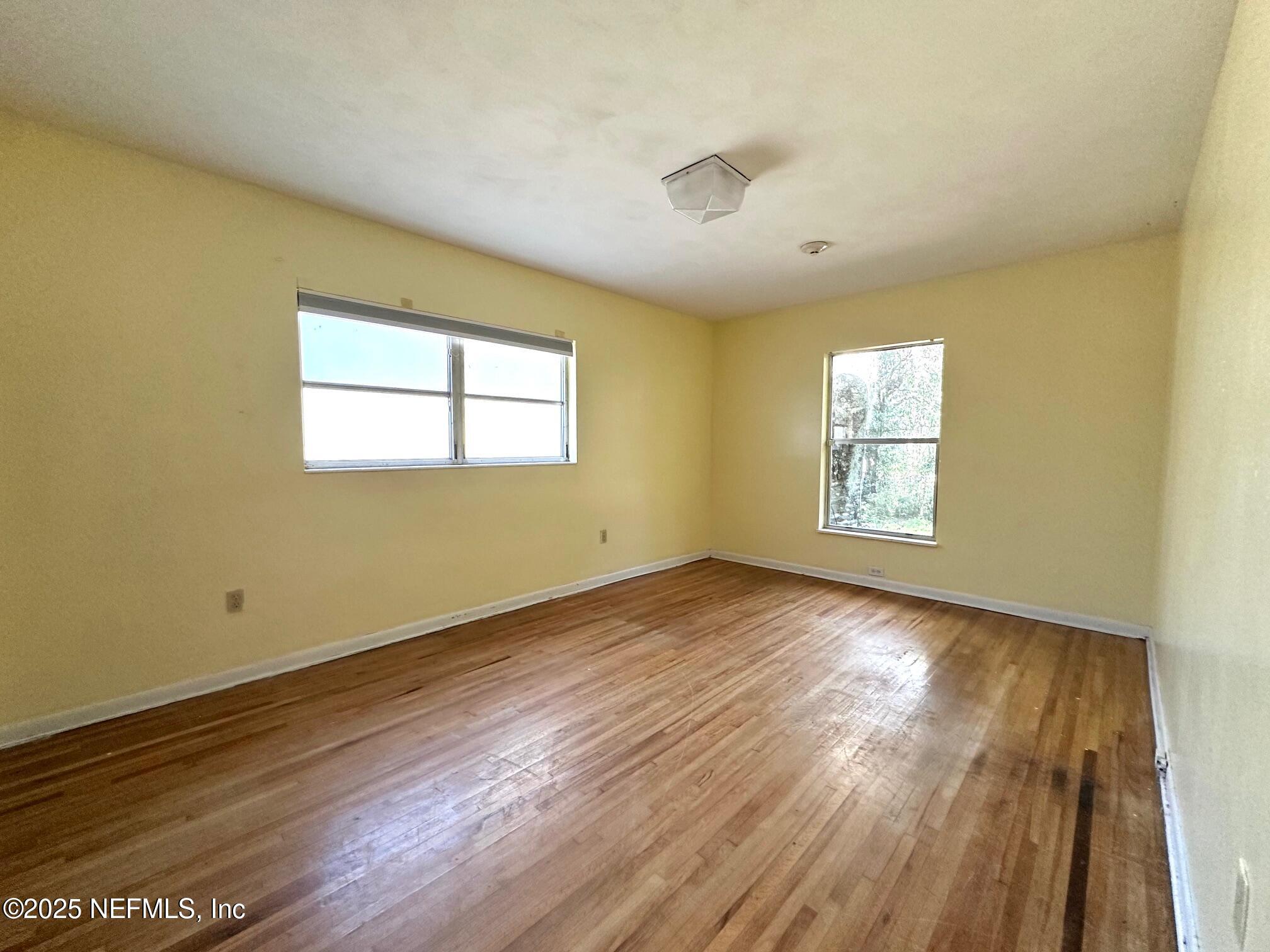 27734 Lake Jem Road Mount Dora, FL 32757 - Photo 11 of 19 a view of empty room with wooden floor and fan