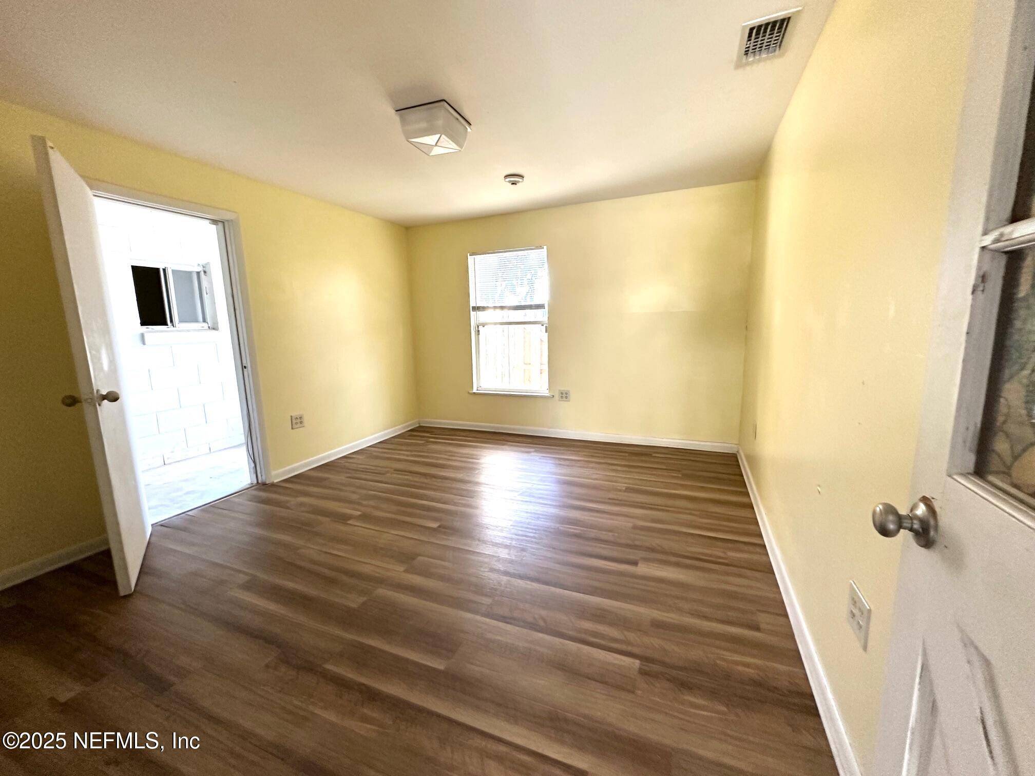 27734 Lake Jem Road Mount Dora, FL 32757 - Photo 13 of 19 a view of a room with wooden floor and white walls