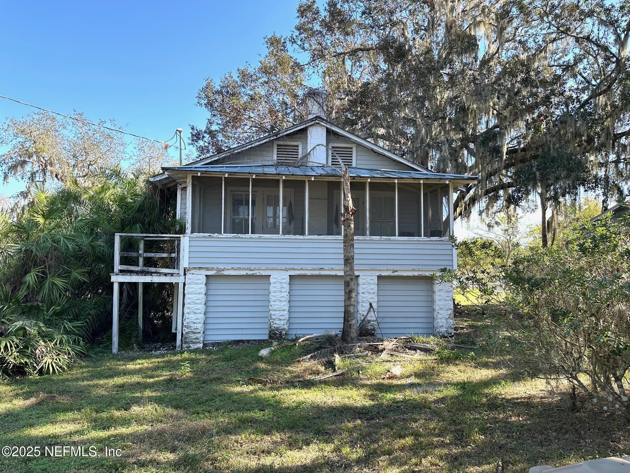 27734 Lake Jem Road Mount Dora, FL 32757 - Photo 17 of 19 a front view of a house with a yard
