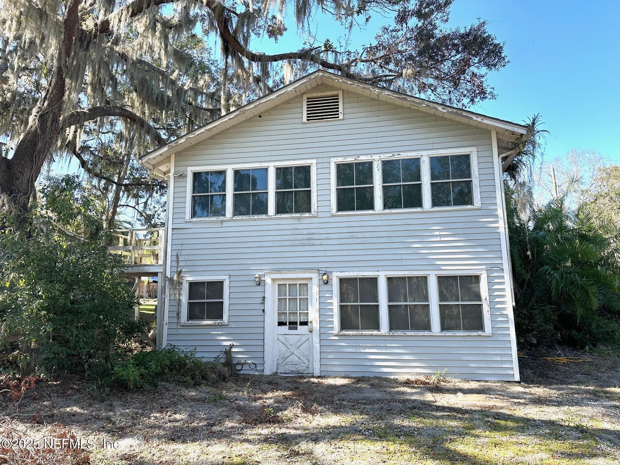27734 Lake Jem Road Mount Dora, FL 32757 - Photo 18 of 19 a front view of a house with a yard