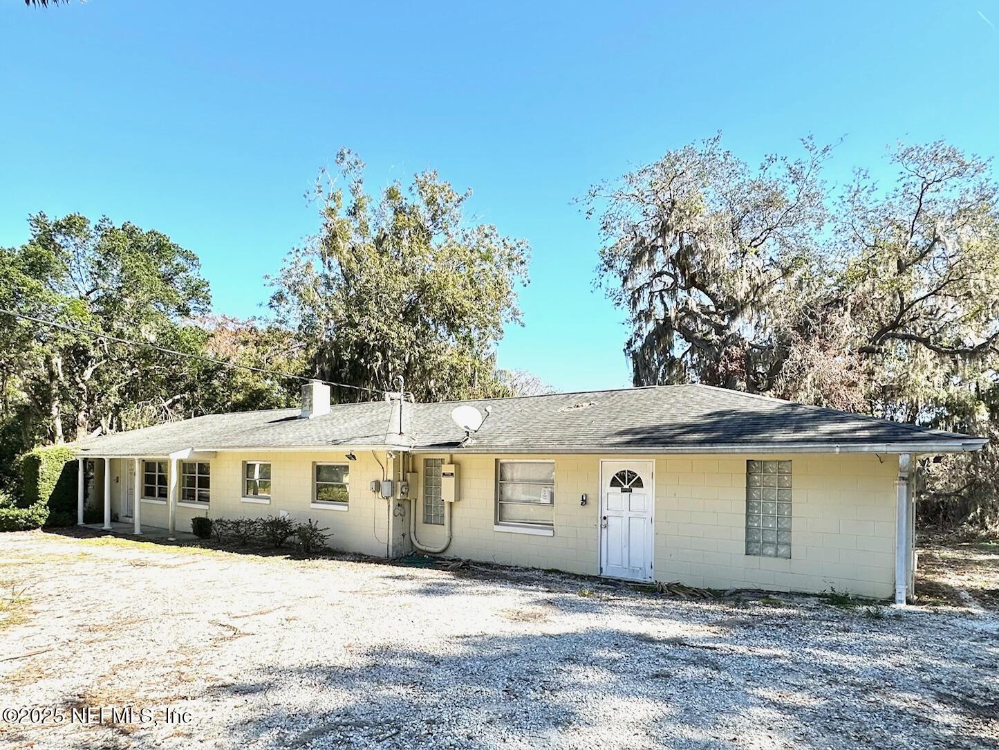 27734 Lake Jem Road Mount Dora, FL 32757 - Photo 2 of 19 a front view of a house with a yard