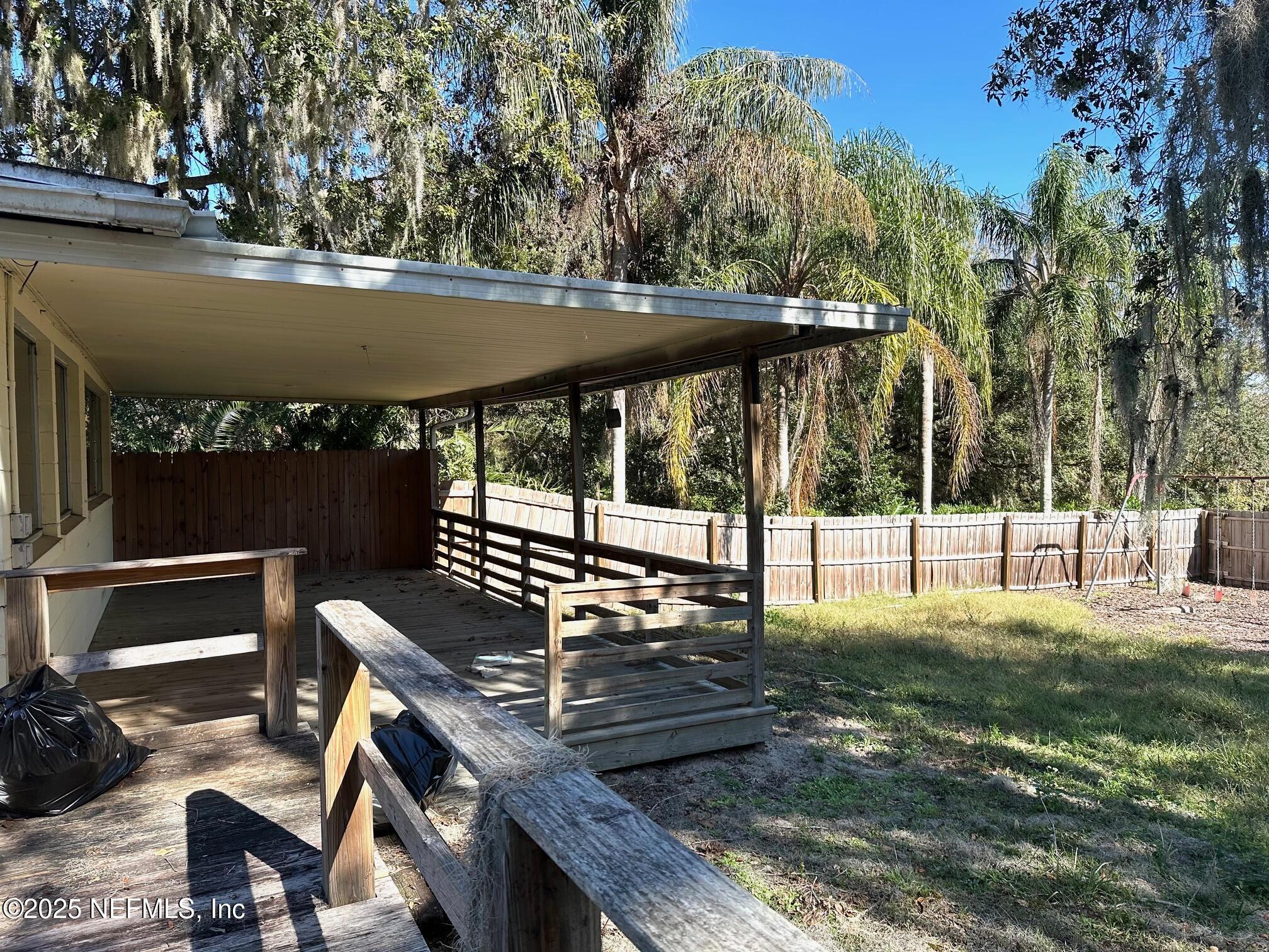 27734 Lake Jem Road Mount Dora, FL 32757 - Photo 3 of 19 a view of a chairs and table on the deck