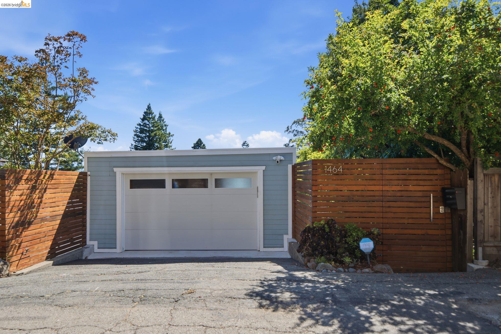 1464 Olympus Avenue Berkeley, CA 94708 - Photo 2 of 61 Detached garage with horizontal wood fencing