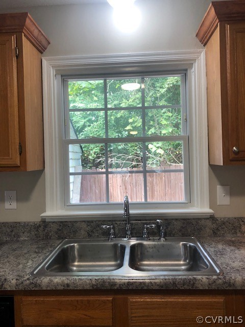6612 Davis Road Quinton, VA 23141 - Photo 10 of 37 The sink has a window with a wooded view.