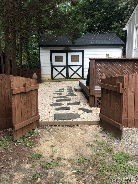 6612 Davis Road Quinton, VA 23141 - Photo 23 of 37 Stone patio with walkway inside freshly stained fe