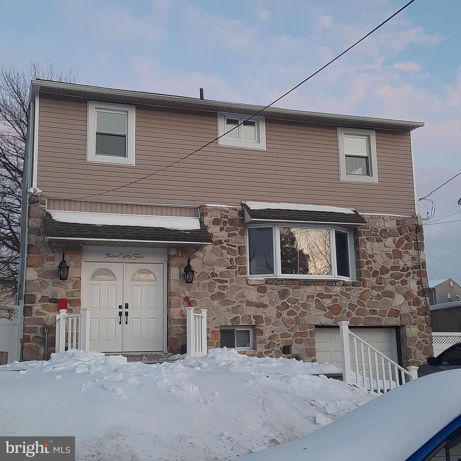 a front view of a house with garage