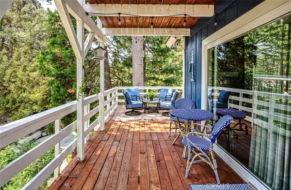 a view of balcony with furniture and wooden deck