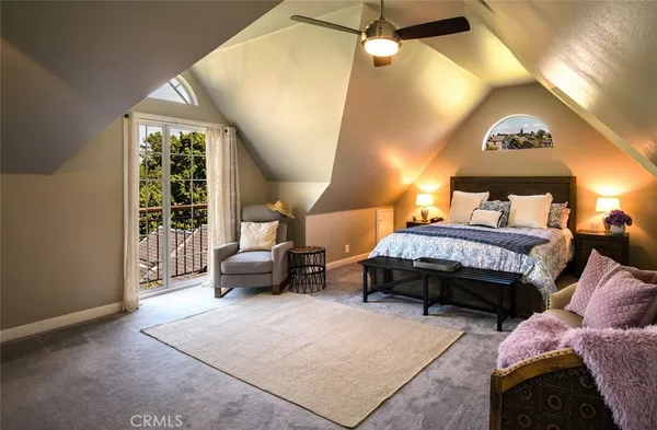 a bedroom with bed and a window