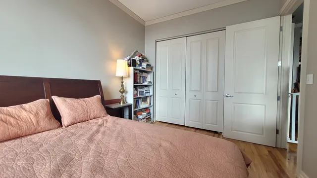 a bedroom with a bed and a closet