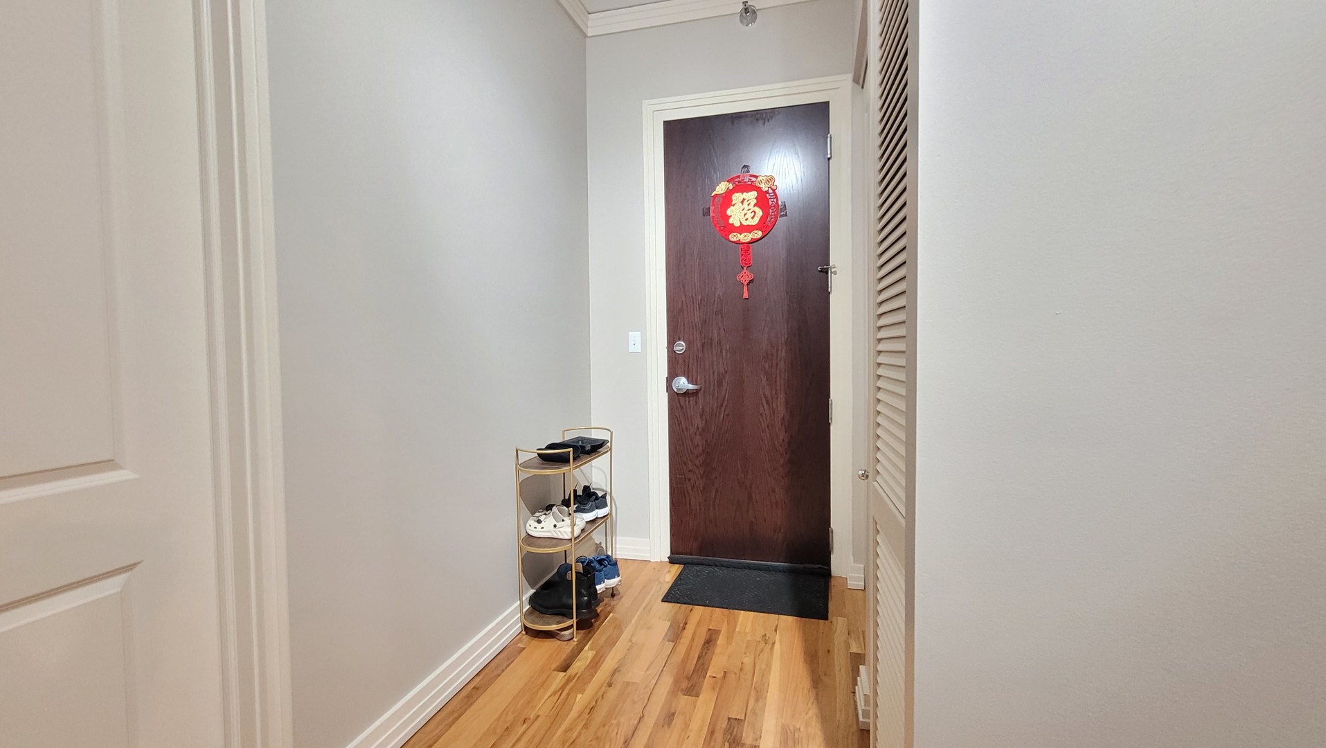 170 West Polk Street, Unit 1003 Chicago, IL 60605 - Photo 22 of 27 a view of a bedroom with wooden floor