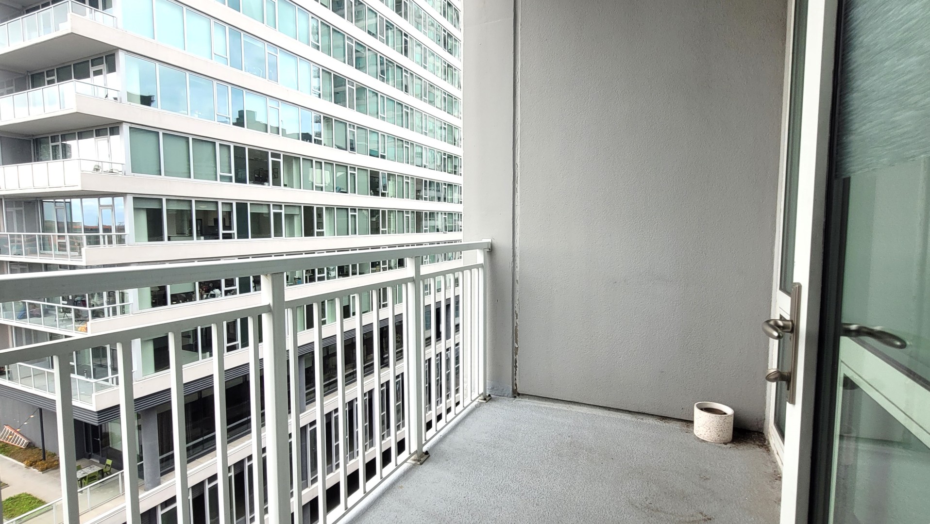 170 West Polk Street, Unit 1003 Chicago, IL 60605 - Photo 24 of 27 a view of staircase with white walls and a window