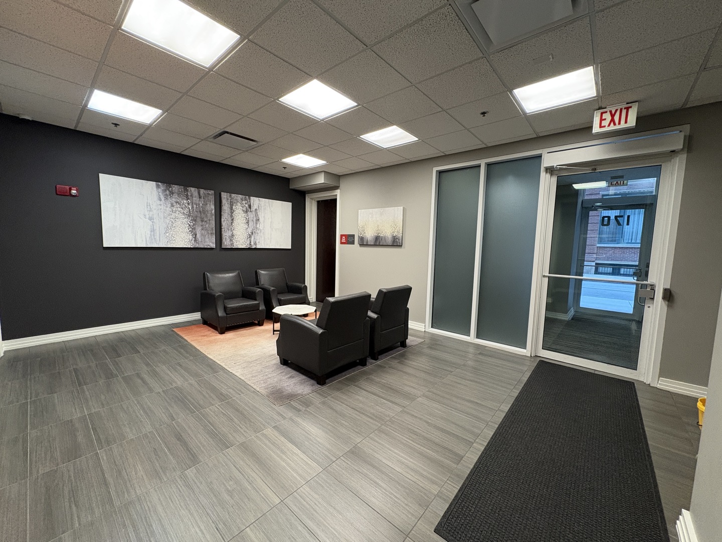 170 West Polk Street, Unit 1003 Chicago, IL 60605 - Photo 3 of 27 a living room with furniture and a flat screen tv