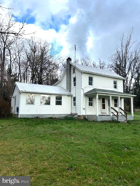 13620 Pryor Road Thurmont, MD 21788 - Photo 1 of 15 Charming white farmhouse in nature's embrace.