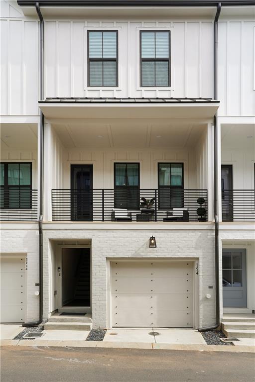 154 Chestnut Circle, Unit 80 Atlanta, GA 30342 - Photo 30 of 31 a view of stainless steel appliances kitchen island wooden cabinets and a window