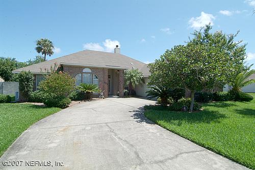 703 Cherry Street Neptune Beach, FL 32266 - Photo 1 of 15 a front view of a house with garden