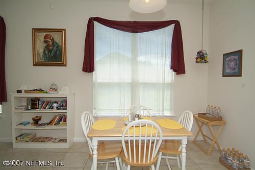 703 Cherry Street Neptune Beach, FL 32266 - Photo 6 of 15 a view of a dining room with furniture