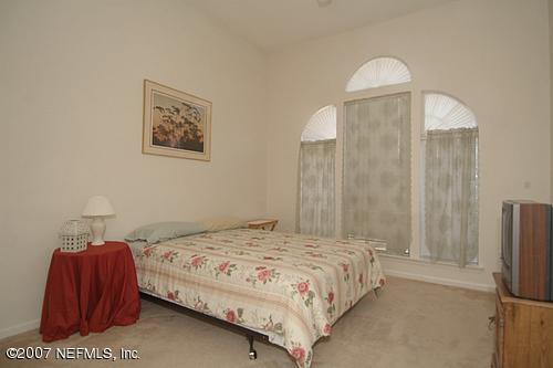703 Cherry Street Neptune Beach, FL 32266 - Photo 10 of 15 a bedroom with a bed and a mirror
