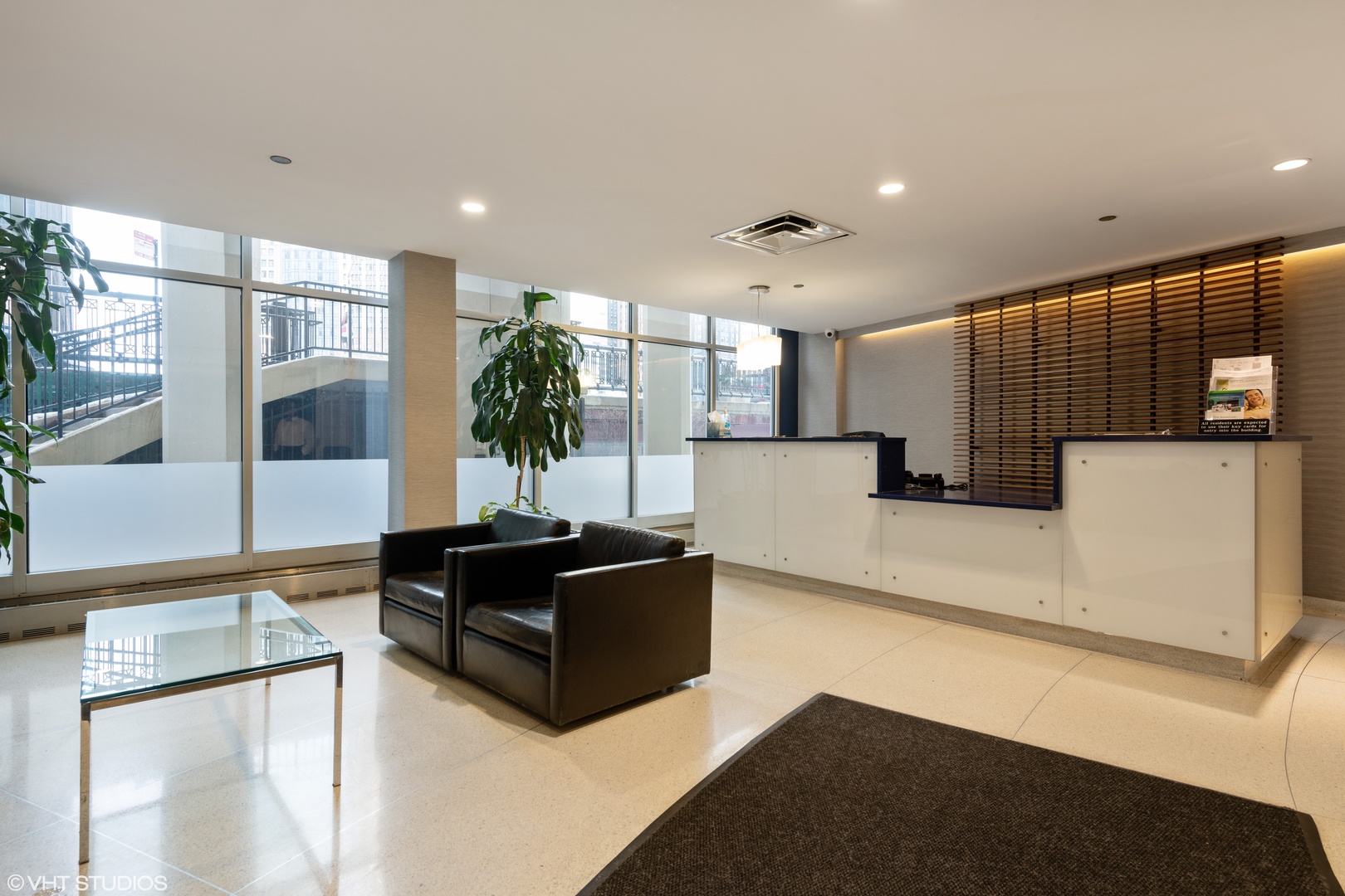 300 North State Street, Unit 4728 Chicago, IL 60654 - Photo 2 of 12 a living room with furniture and a large window