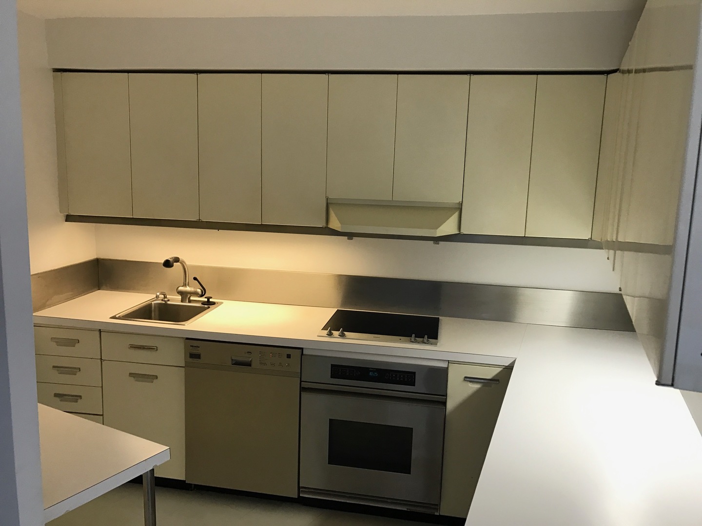 300 North State Street, Unit 4728 Chicago, IL 60654 - Photo 4 of 12 a kitchen with a sink and cabinets