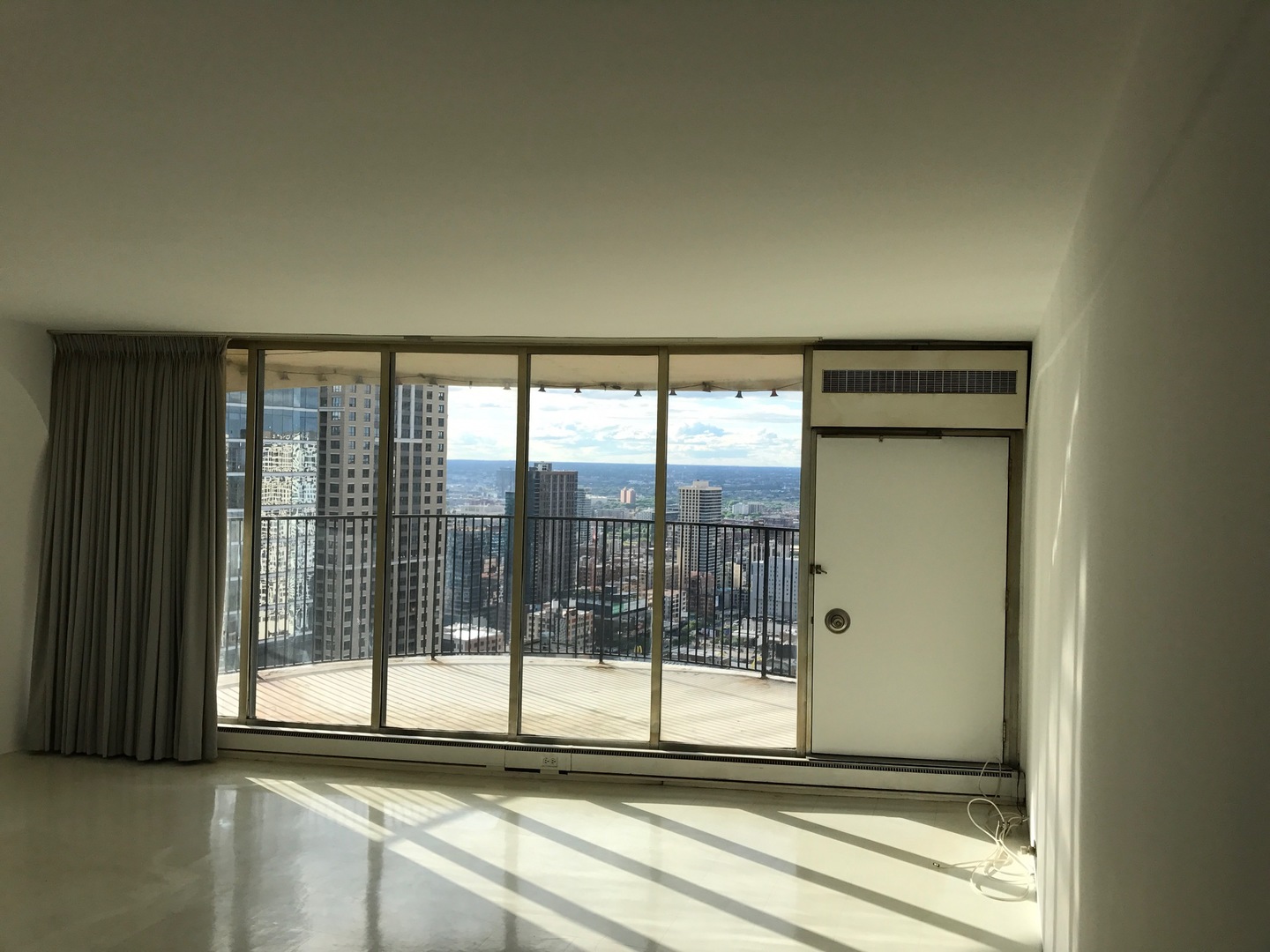 300 North State Street, Unit 4728 Chicago, IL 60654 - Photo 6 of 12 a view of a large window with an empty room
