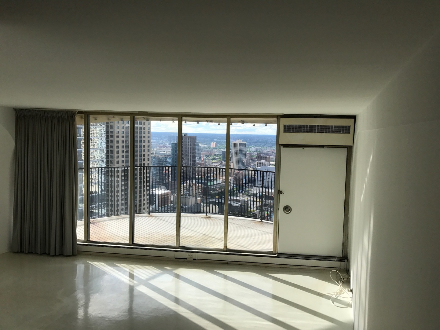 300 North State Street, Unit 4728 Chicago, IL 60654 - Photo 7 of 12 a view of a glass door with a sink