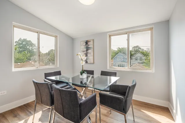 a dining room with furniture and windows