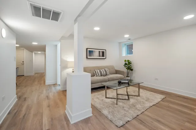 a living room with furniture and a rug