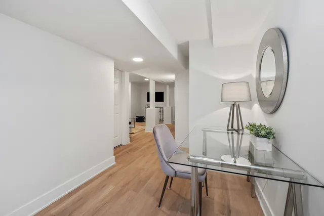 a view of a dining room with furniture and wooden floor