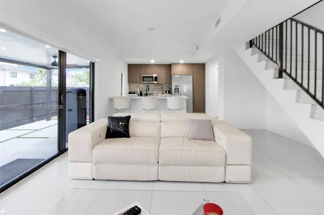 a living room with furniture and a table