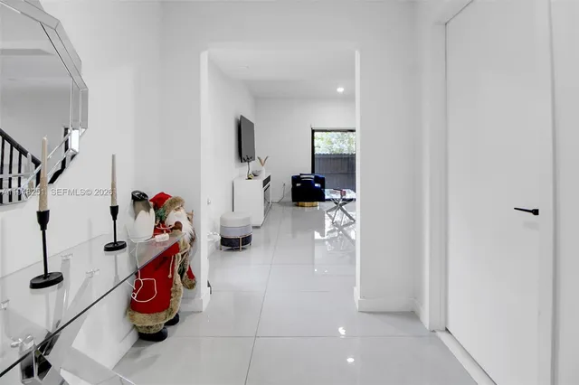 a kitchen with stainless steel appliances kitchen island granite countertop a sink and cabinets