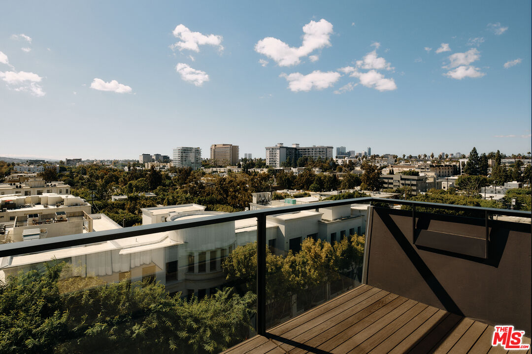 8899 Beverly Boulevard, Unit 8C Los Angeles, CA 90048 - Photo 19 of 33 a city view from a balcony