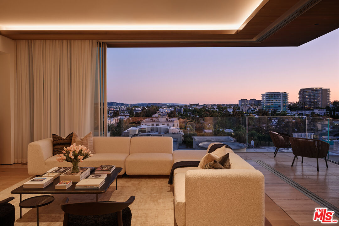8899 Beverly Boulevard, Unit 8C Los Angeles, CA 90048 - Photo 2 of 33 a living room with furniture and a city view