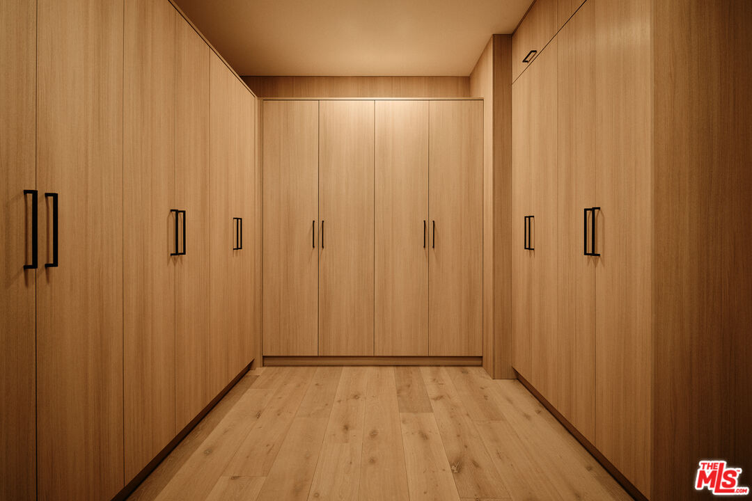 8899 Beverly Boulevard, Unit 8C Los Angeles, CA 90048 - Photo 22 of 33 a view of a hallway with wooden floor