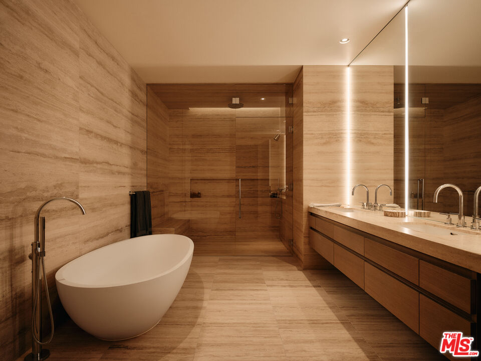 8899 Beverly Boulevard, Unit 8C Los Angeles, CA 90048 - Photo 25 of 33 a bathroom with a sink and mirror