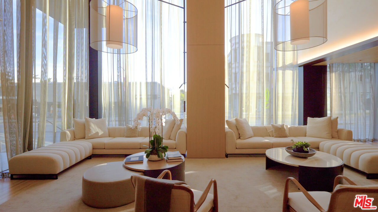 8899 Beverly Boulevard, Unit 8C Los Angeles, CA 90048 - Photo 30 of 33 a living room with furniture and a large window