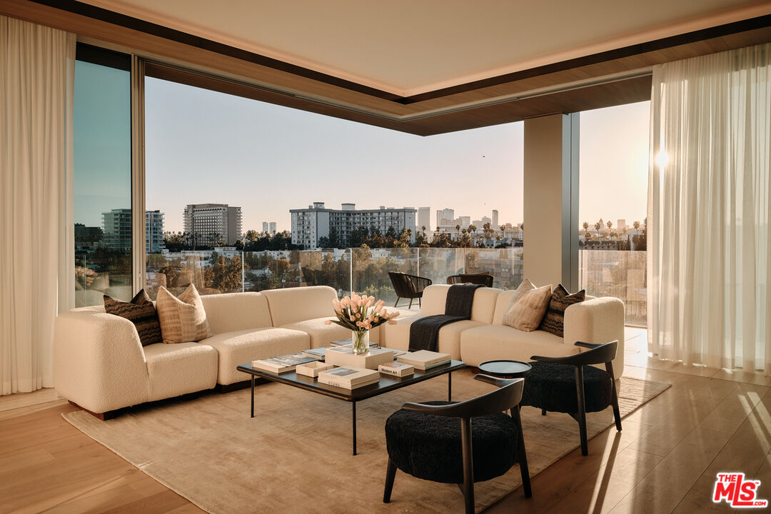 8899 Beverly Boulevard, Unit 8C Los Angeles, CA 90048 - Photo 3 of 33 a living room with furniture and a large window