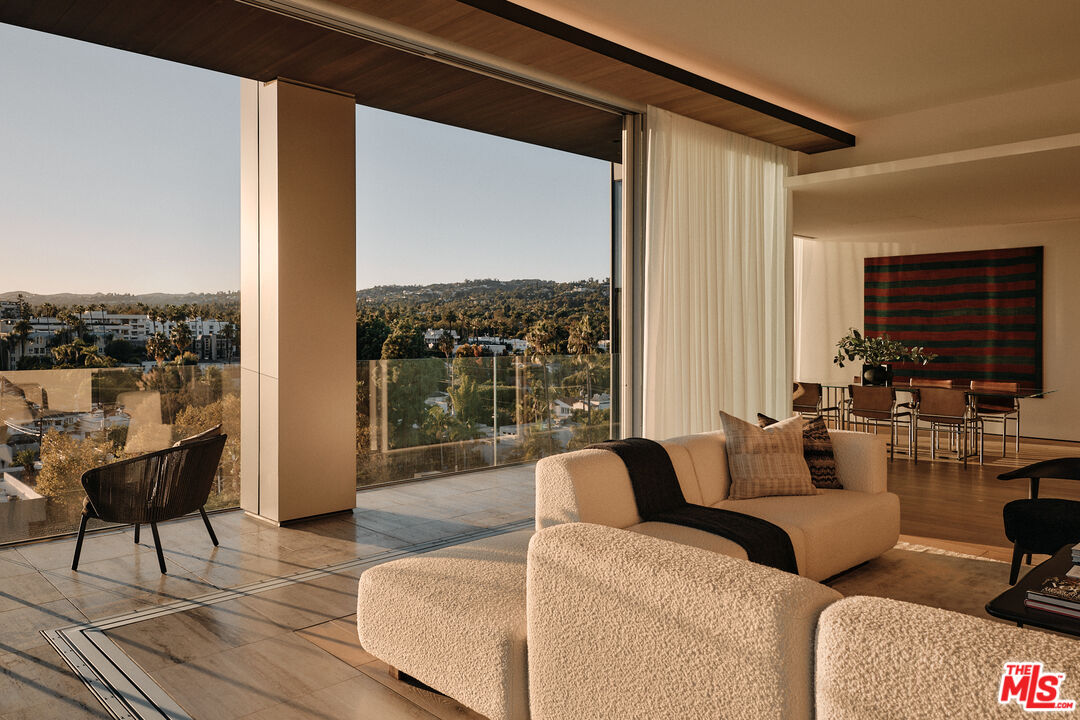 8899 Beverly Boulevard, Unit 8C Los Angeles, CA 90048 - Photo 4 of 33 a living room with furniture and a large window