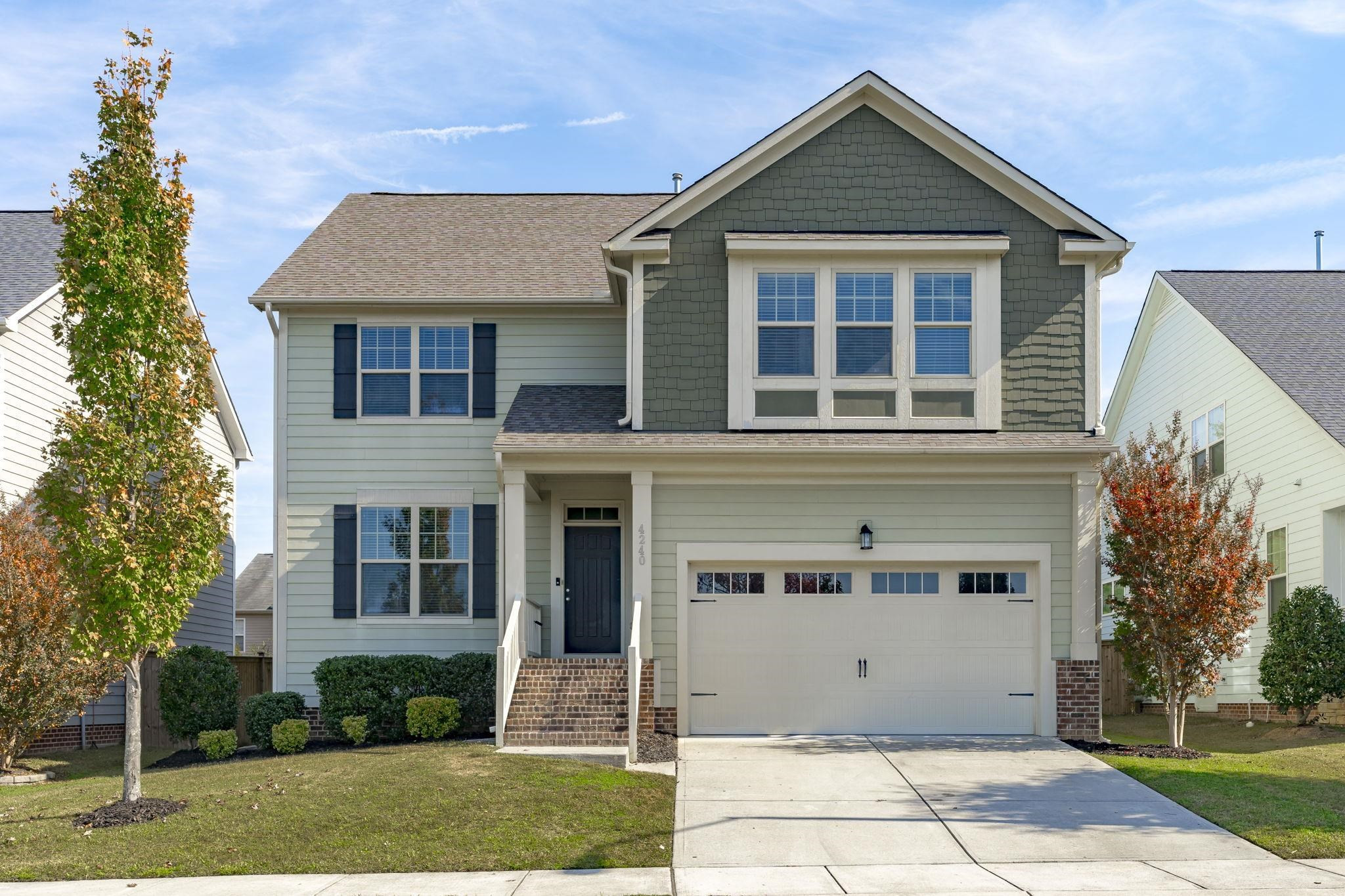 4240 Rockdell Hall Street Raleigh, NC 27616 - Photo 1 of 39 a front view of a house with a yard