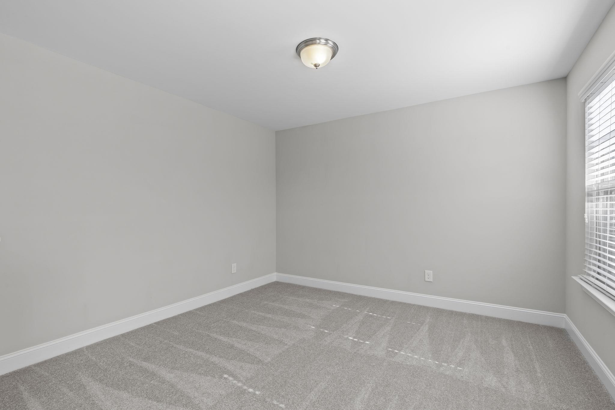 4240 Rockdell Hall Street Raleigh, NC 27616 - Photo 22 of 39 a view of an empty room with a window