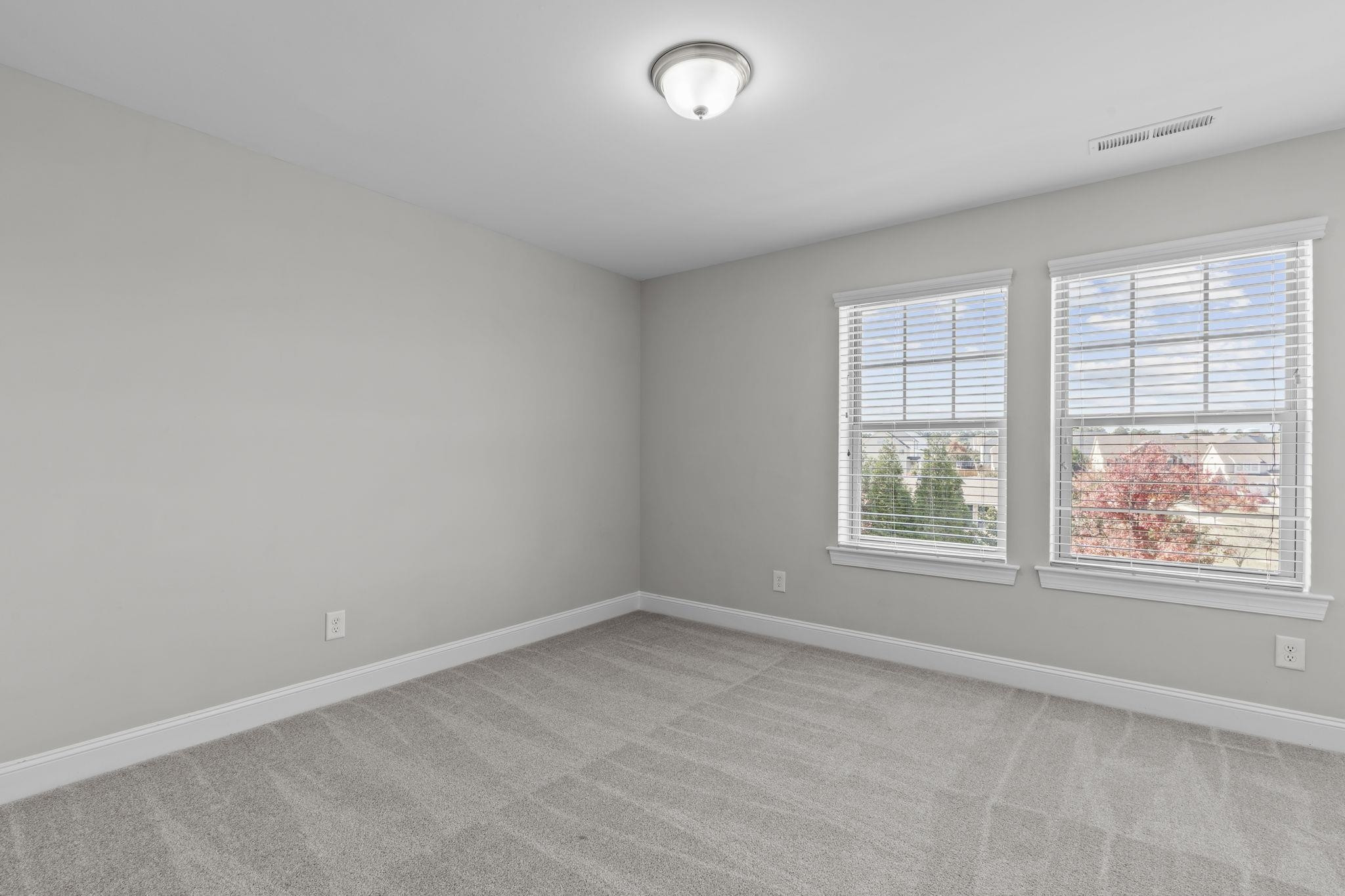 4240 Rockdell Hall Street Raleigh, NC 27616 - Photo 25 of 39 an empty room with windows