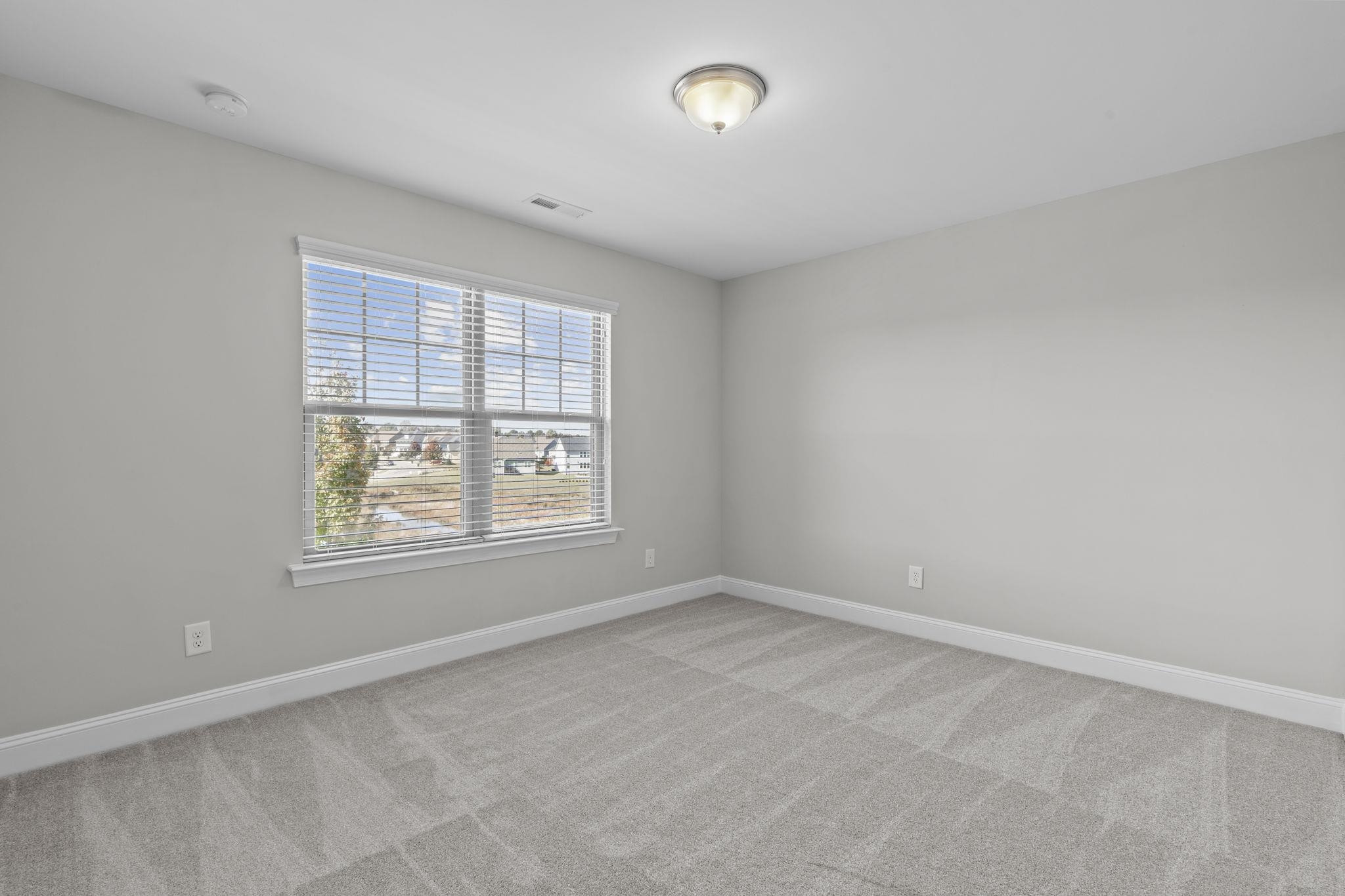 4240 Rockdell Hall Street Raleigh, NC 27616 - Photo 29 of 39 an empty room with windows