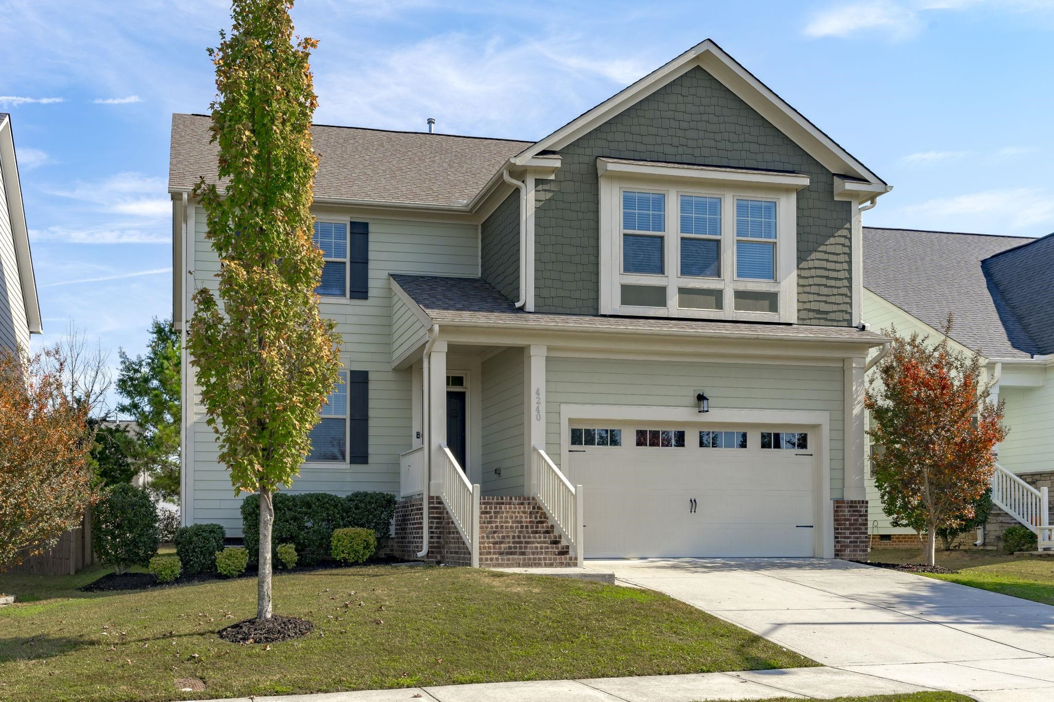 4240 Rockdell Hall Street Raleigh, NC 27616 - Photo 3 of 39 a front view of a house with a yard