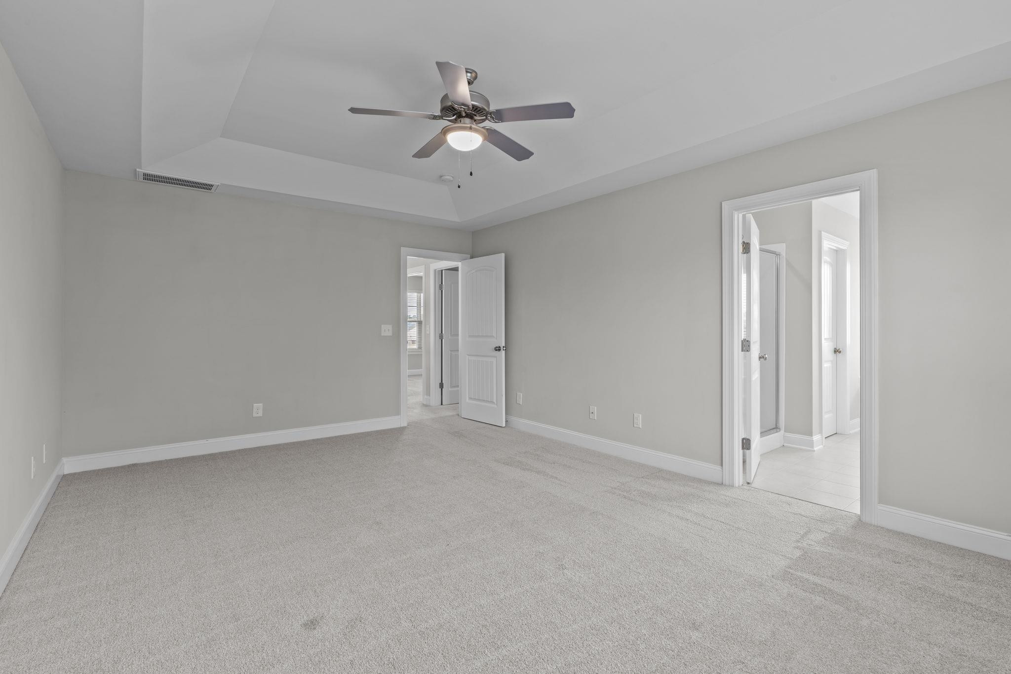 4240 Rockdell Hall Street Raleigh, NC 27616 - Photo 33 of 39 a view of an empty room with a ceiling fan