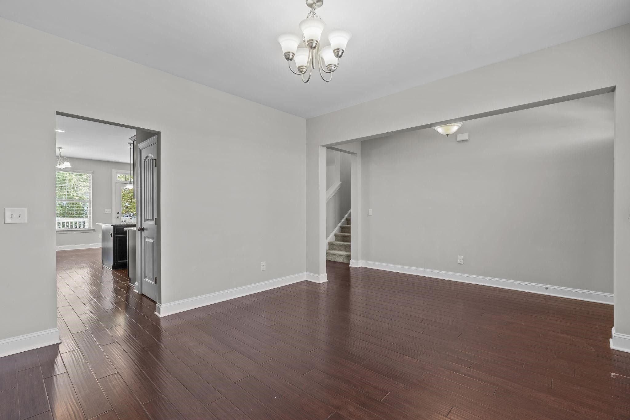 4240 Rockdell Hall Street Raleigh, NC 27616 - Photo 8 of 39 a view of a livingroom with wooden floor