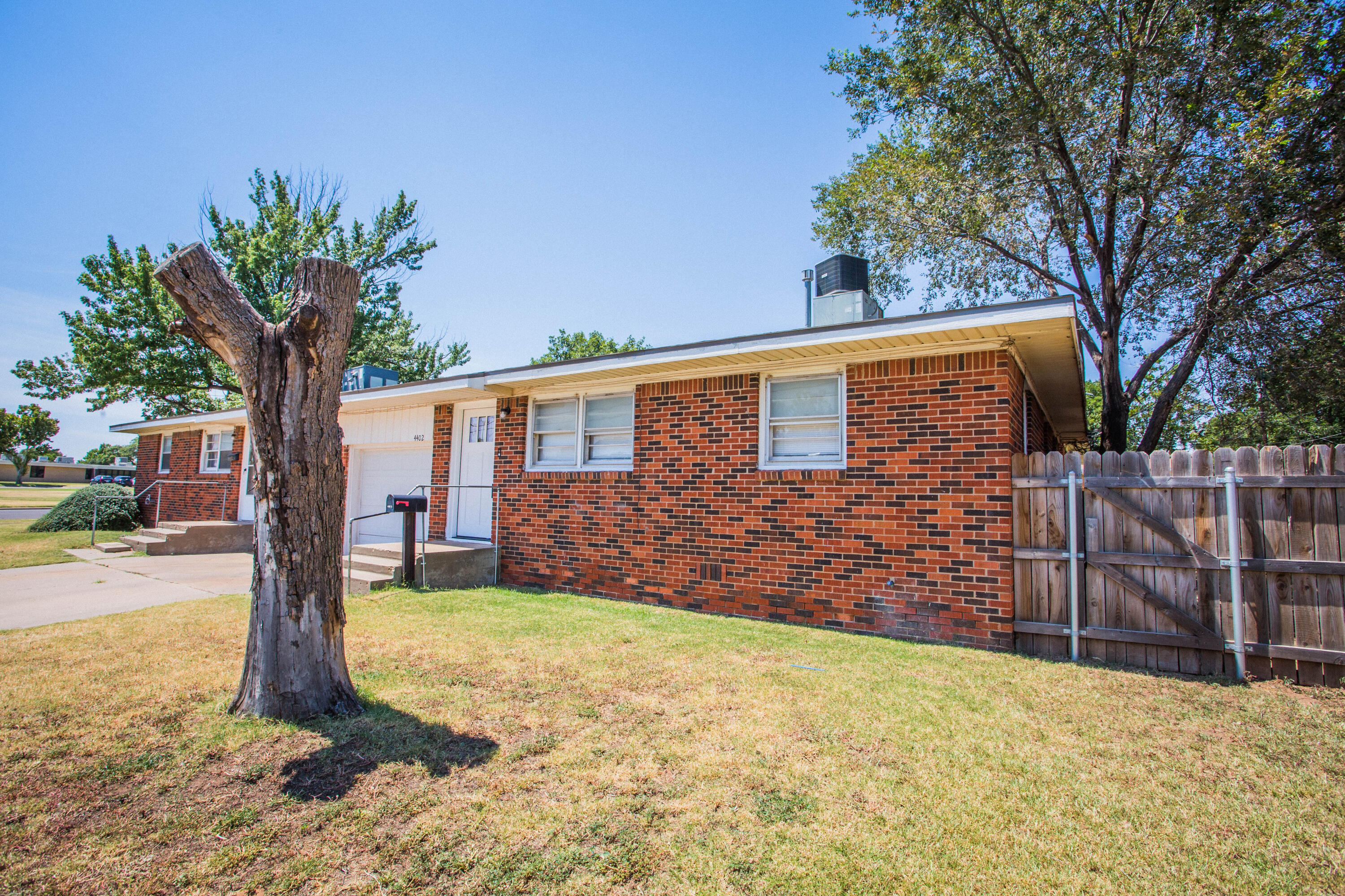 4402 29th Street, Unit B Lubbock, TX 79410 - Photo 23 of 23 a front view of a house with garden