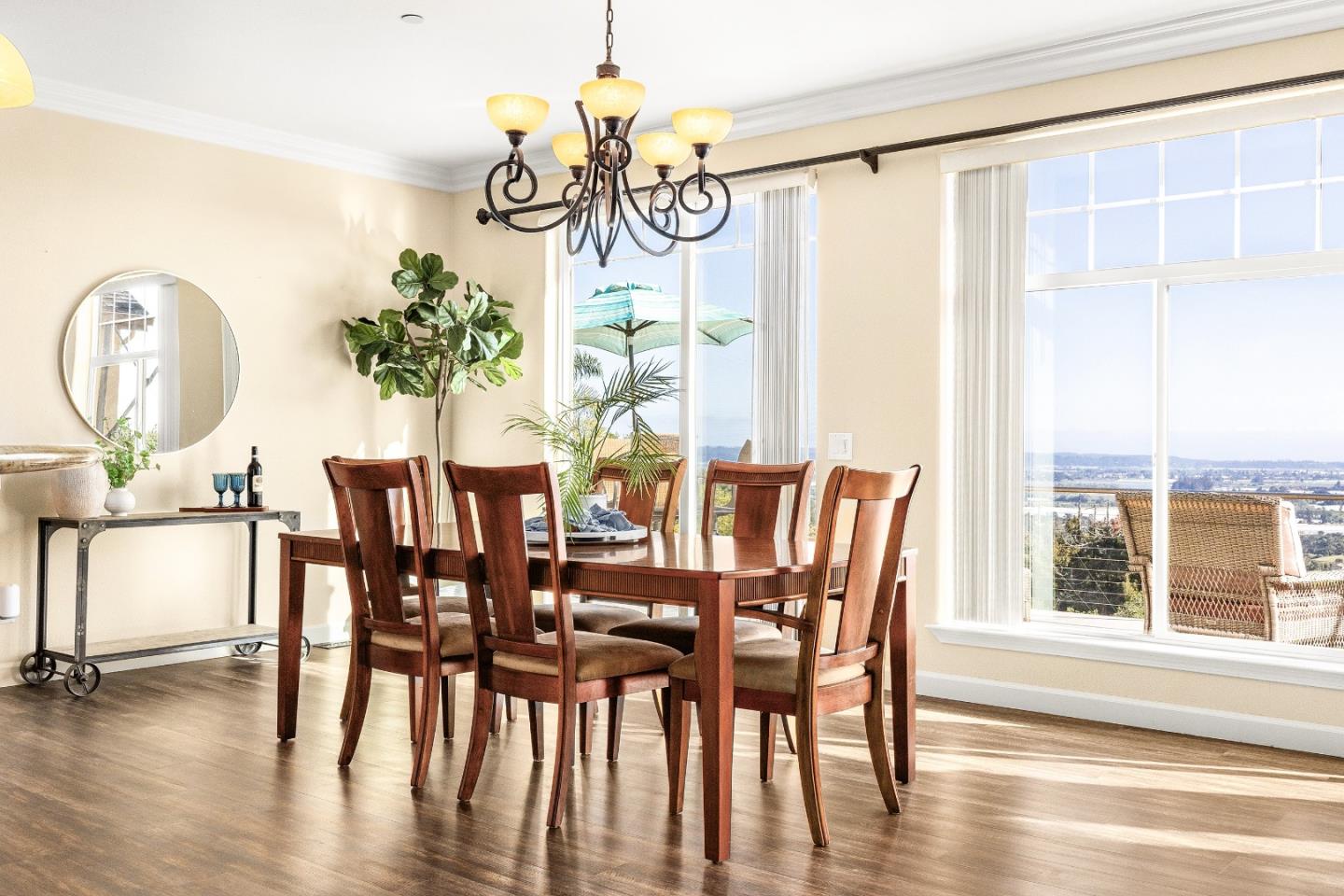 960 Smith Road Watsonville, CA 95076 - Photo 16 of 53 a dining room with furniture potted plants and wooden floor