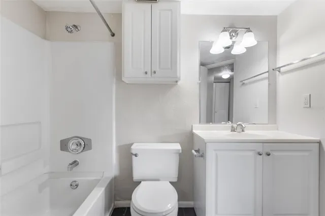 a bathroom with a sink a toilet and bathtub